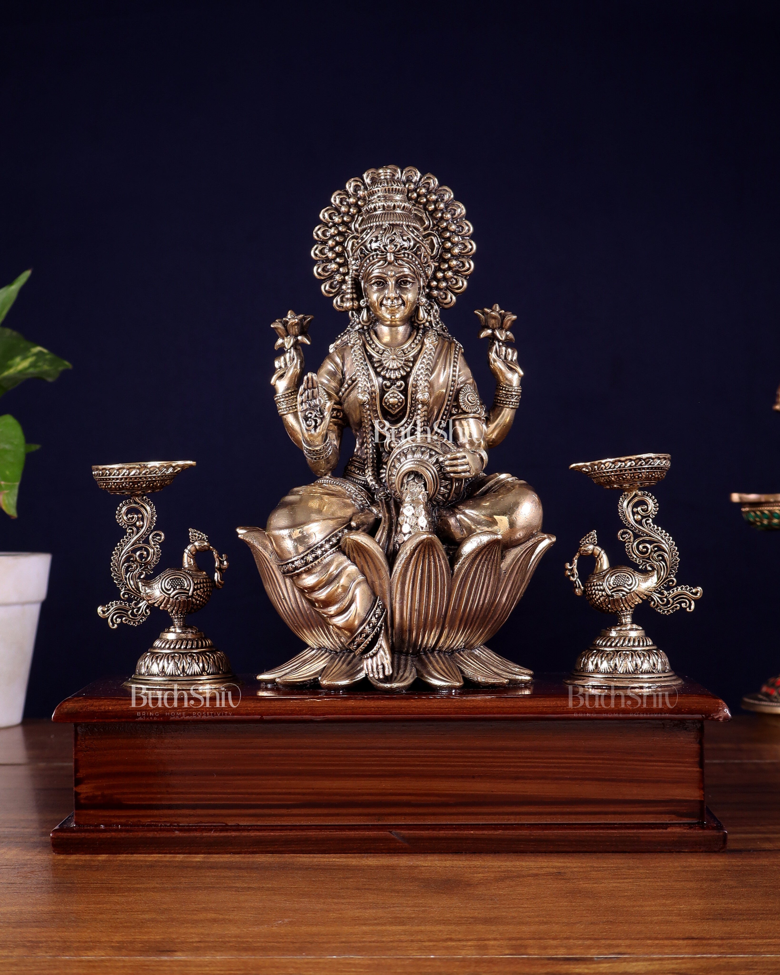 Brass Superfine Goddess Lakshmi Idol with Twin Peacock Lamps on Wooden Base – 9.5 Inch