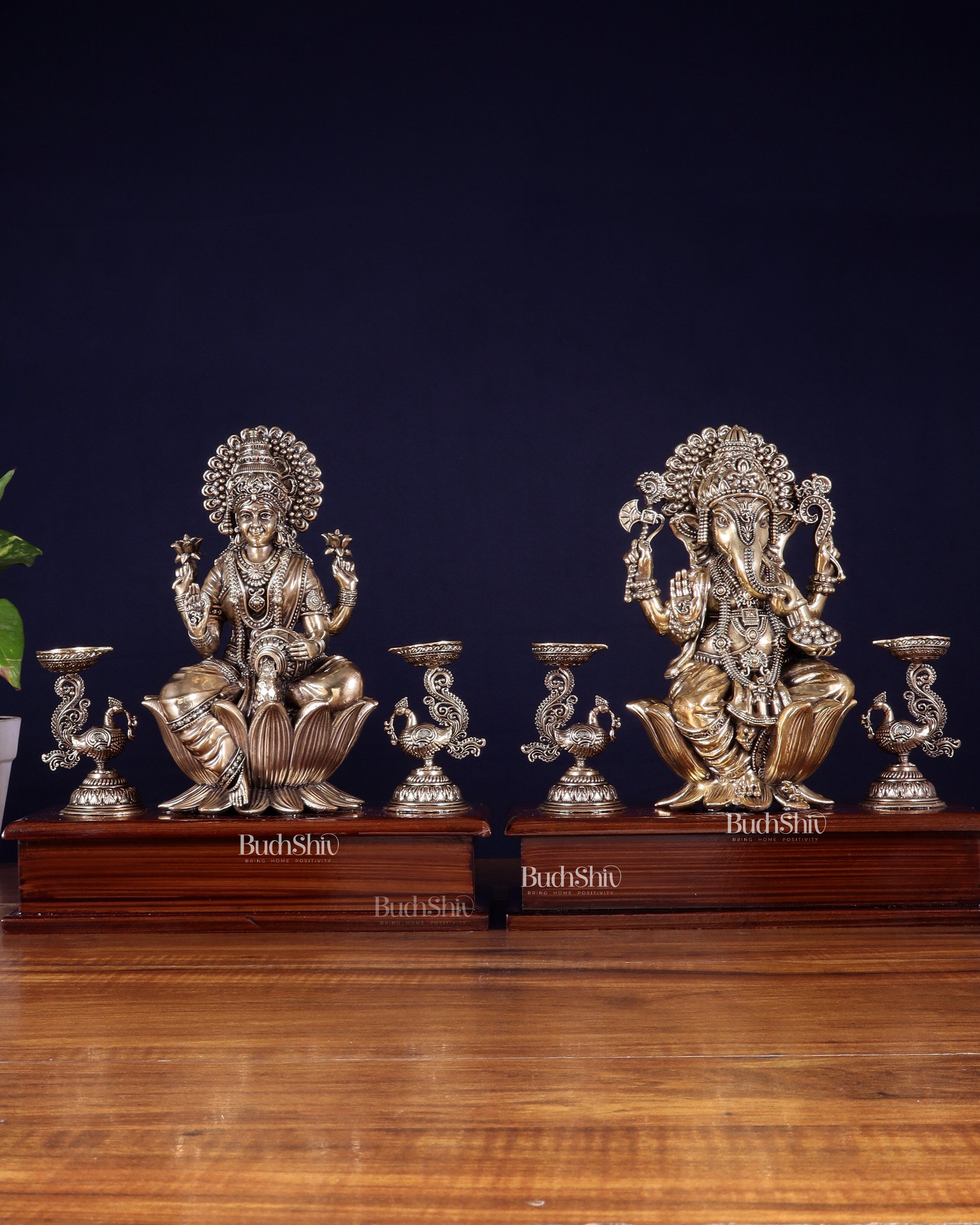 Brass Superfine Ganesh–Lakshmi Pair with Twin Peacock Lamps on Wooden Base – 9.5 Inch