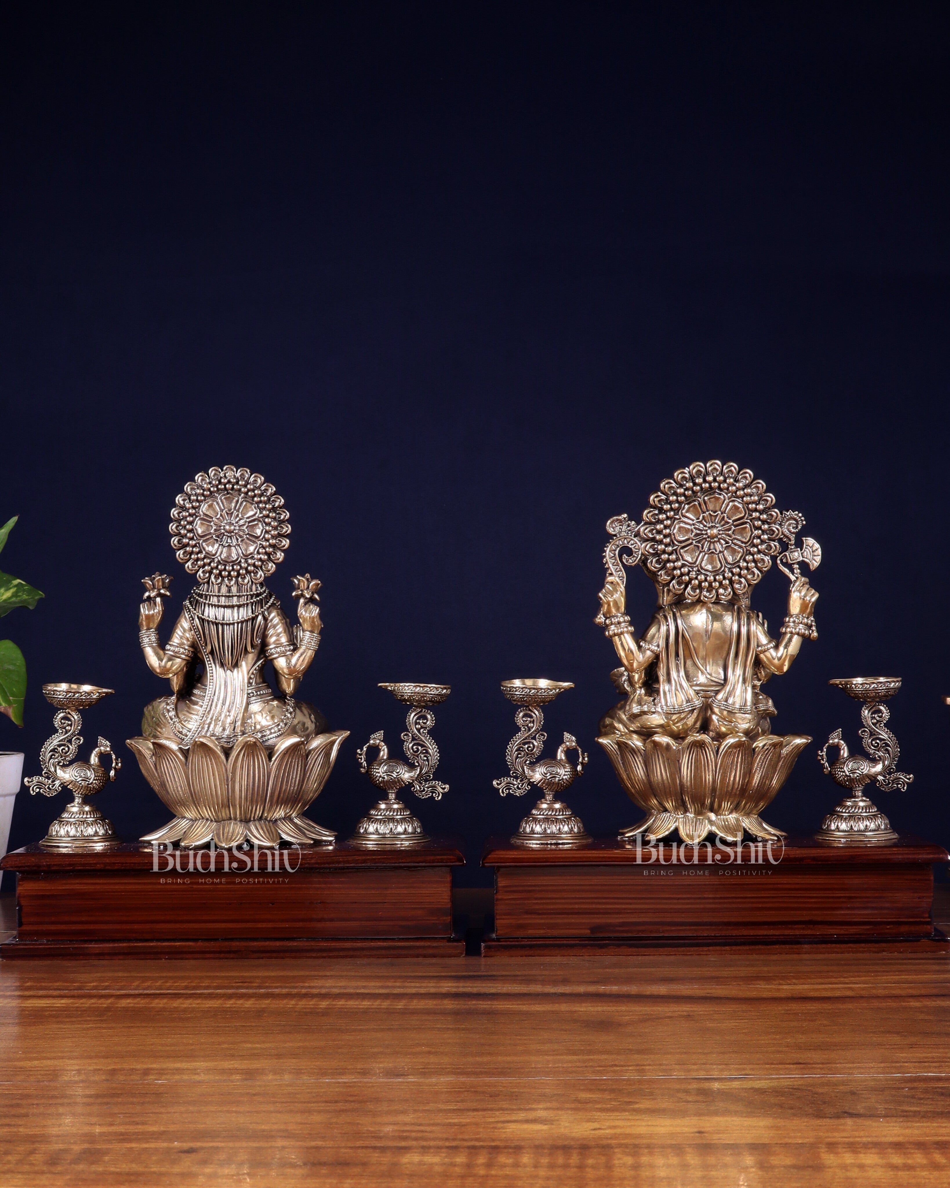 Brass Superfine Ganesh–Lakshmi Pair with Twin Peacock Lamps on Wooden Base – 9.5 Inch